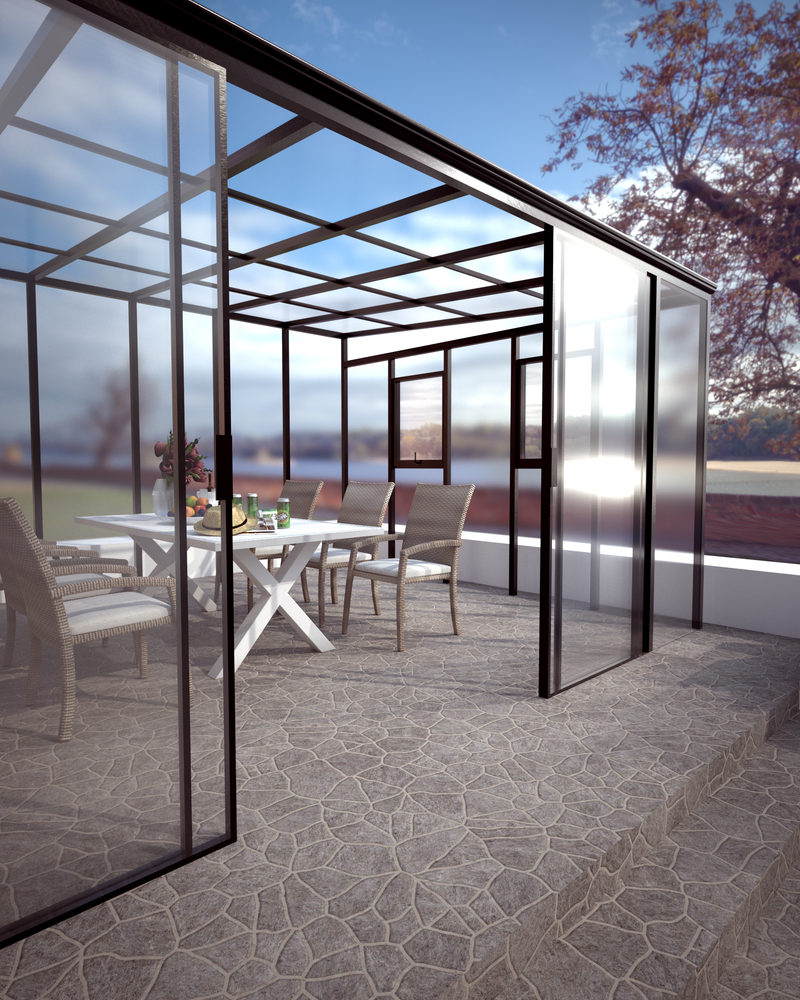 Enclosed glass room with dining setting